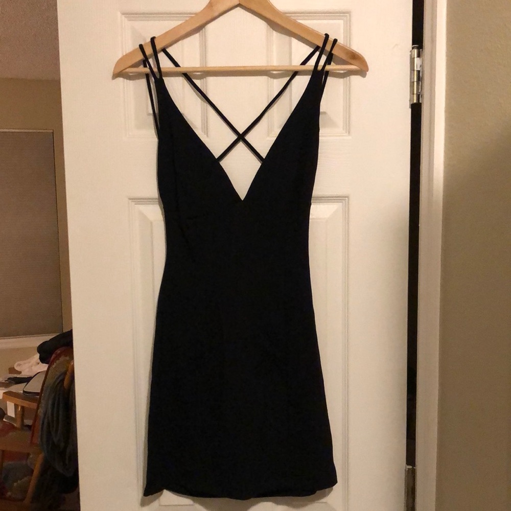 Lulu’s little black dress with v neck and cross straps in back size large